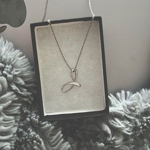 Never worn- Sliver cursive “J” necklace.